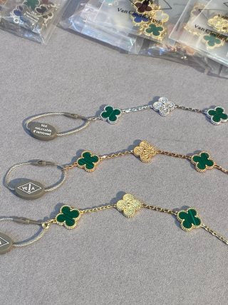 Van Cleef & Arpels Malachite 5-Motif Clover Bracelet with Gold-Tone Details